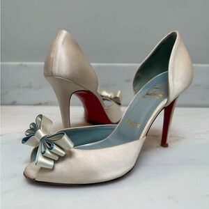 Christian Louboutin ivory satin heels with baby blue within bow. Size 37.5